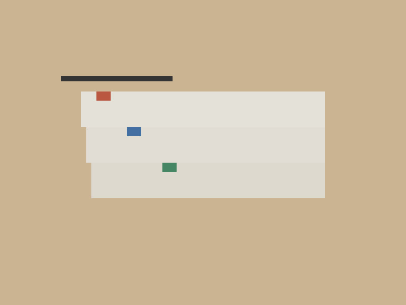 A stack of tabbed paper files on a wooden desk.